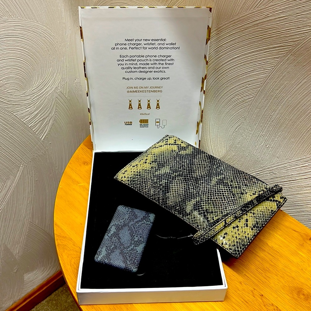 Wristlet, phone charger, and wallet all in one!  NEW